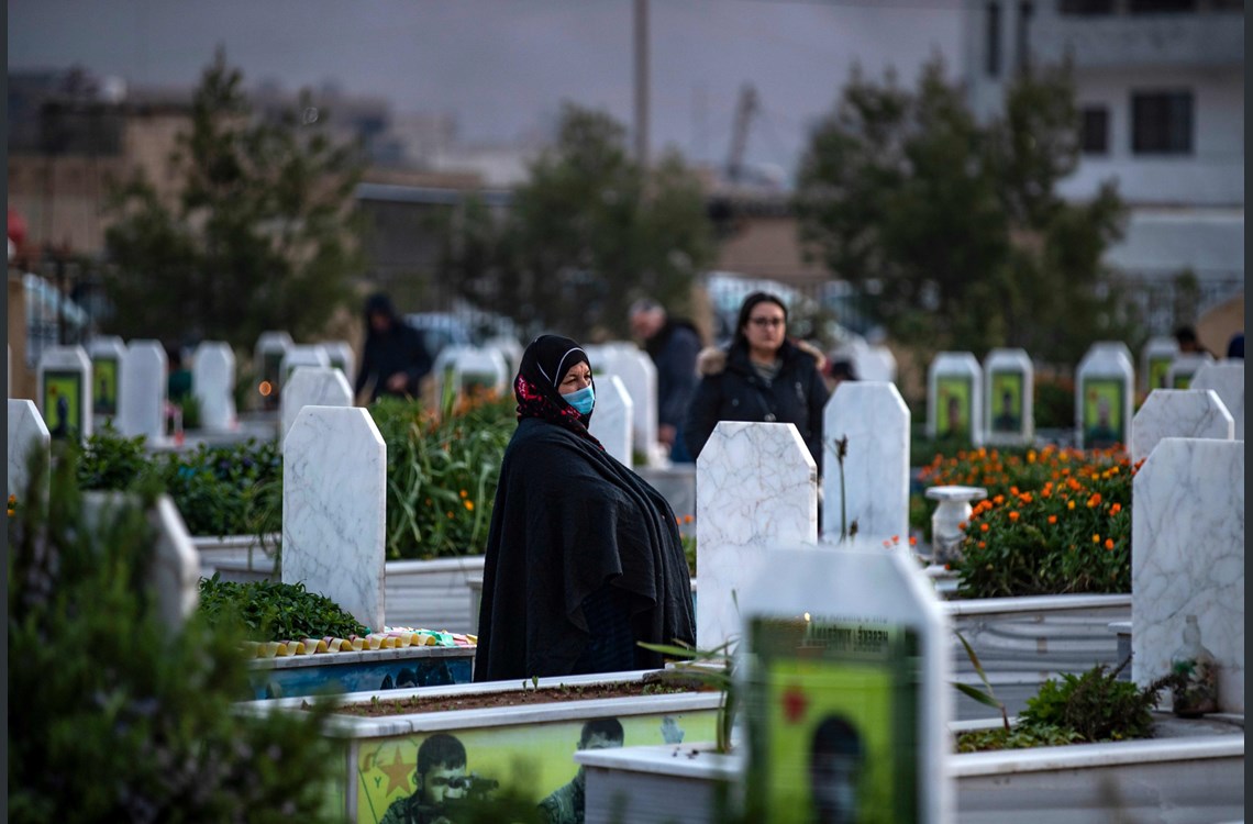 Women visit the graves of SDF fighters during Newroz celebration in Qamishli in Syria's northeastern Hasaka province on March 20, 2020 (3)
